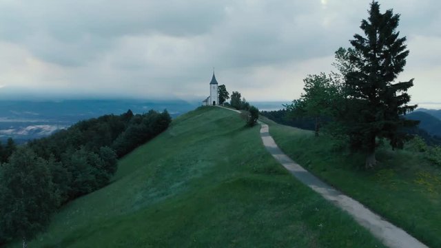 Aerial view over Lonely Chapel of  St. Primus and Felician, Jamnik, Slovenia