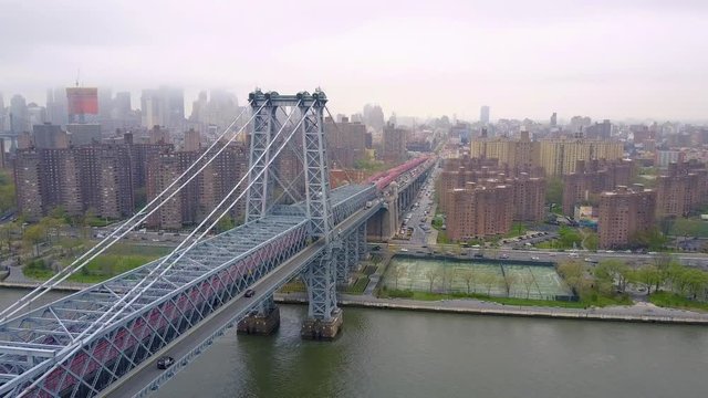 New York City skyline aerial of East River and Williamsburg Bridge drone shot.