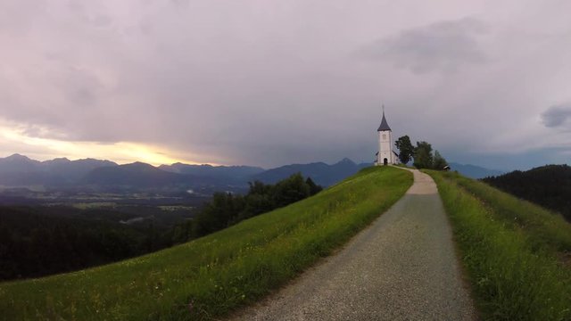 Time lapse sunrise at Church of St. Primus and Felician, Jamnik, Slovenia 