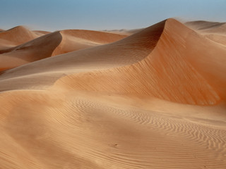 The dunes of the Wahiba Sands desert in Oman at sunset during a typical summer sand storm - 12
