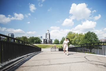 Fototapeta premium girl walking on a sunny day in the city