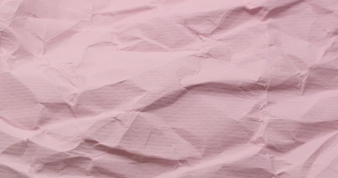 Wrinkle pink paper texture in rotation