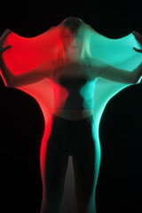 Girl posing in sportswear on a black background in a transparent bag