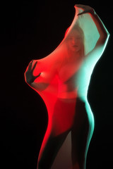 Girl posing in sportswear on a black background in a transparent bag