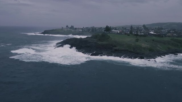 Kiama storm waves in NSW Australia coastal - 4k drone video of waves crashing on the Kiama shore.