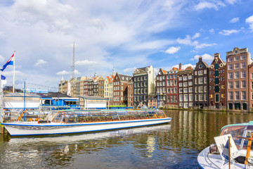 Colorful traditional old buildings in sunshine day at Amsterdam, Netherlands