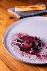 Creative Fine Dinning: Sliced beetroot wrap with goat cheese, blackberry and walnut served with bread.