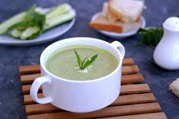 Summer cold yoghurt soup with fresh cucumber, green peas and mint 