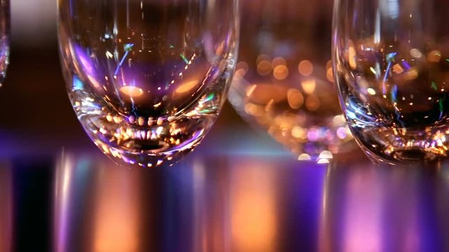 Stemware, wineglass close-up, glasses on the bar. Bar theme, beverages. Nightlife