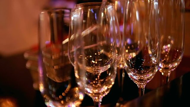 Stemware, wineglass close-up, glasses on the bar. Bar theme, beverages. Nightlife