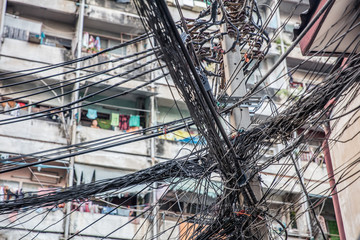 messy, chaotic power and telephone cables