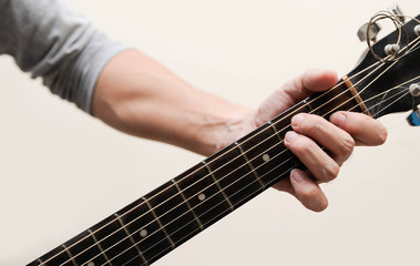 Guitar chords,Selective focus,Guitarist,The musicians are catching the guitar chords is E chord on...