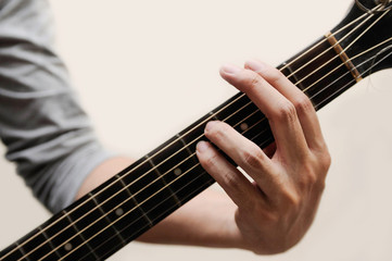 Fototapeta premium Guitar chords,Selective focus,Guitarist,The musicians are catching the guitar chords is F sharp minor chord on white background