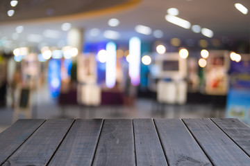 Empty of black wooden table on front blurred colorful background, for presentation you product, template