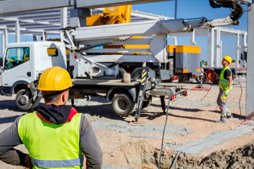 Boss oversees, control work on construction site