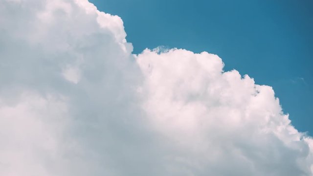 Time-lapse Of Bright Blue Sky With White Fluffy Clouds. Cloudy Sky. Blue Sunny Cloudscape