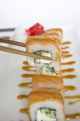 sushi rolls in sticks bokeh wasabi and ginger