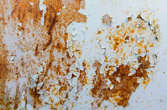 Texture of rusty metal with peeling blue paint