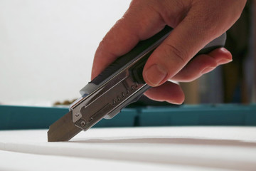 utility stationary knife in hand