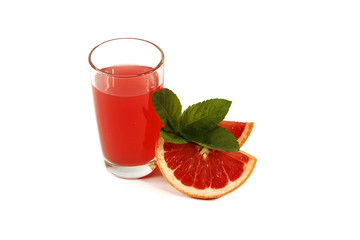 Fresh grapefruit juice with mint in a glass cup isolated on white background. Grapefruit fresh and juice on a white background, view of the shu, cospore space