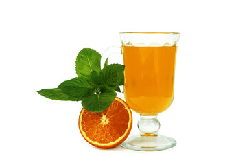 Fresh orange juice with mint in a glass cup isolated on white background. Fresh oranges and juice on a white background, view of the shu, cospore space.