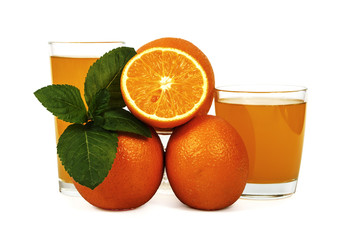 Fresh orange juice with mint in a glass cup isolated on white background. Fresh oranges and juice on a white background, view of the shu, cospore space.