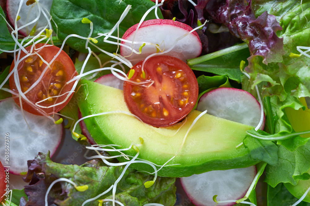 Wall mural avocado salad with sprouts tomatoes spinach