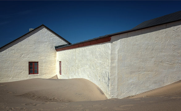 Old fishing houses at Stenbjerg Strand, on the Danish west coast.