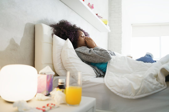 Black Woman With Flu And Cold Holding Ice Bag