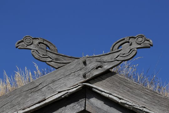 viking house with wooden dragon heads