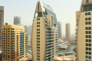 Fototapeta premium Beautiful cityscape. Skyscrapers in Dubai. City of the future. Background. United Arab Emirates. Dubai, March, 2018.