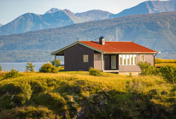 Fototapeta na wymiar House in Norway, Europe. Mountains and river.