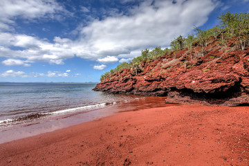 Red rocky coastline of Rabida Island in the Galapagos