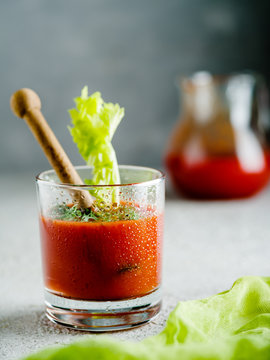 Tomato juice in glass with celery.