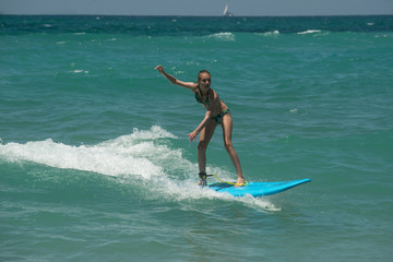 Beautiful young surfer girl