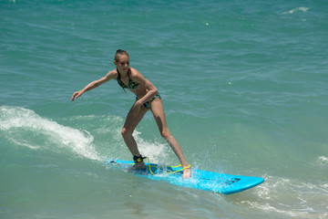 Beautiful young surfer girl