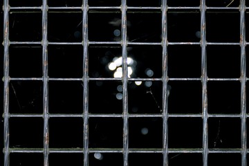 The texture of the lattice of the silver floor, the light passes through the lattice, the...