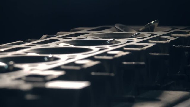 close up refocusing shot of disassembled car's engine with valves. 4k shot