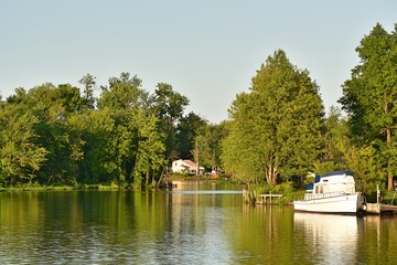 Fototapeta na wymiar Boat In River With Trees