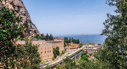 Obraz premium Benedictine abbey Santa Maria de Montserrat on a multi-peaked rocky range Montserrat. Barcelona, Spain.
