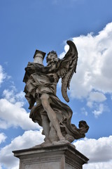 Fototapeta na wymiar Rome, statues of the angels sculpted by pupils of Bernini in 1669 and placed on the S. Angelo bridge. Details and close-up