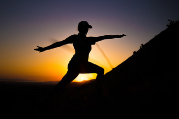 Silhouette of girl doing yoga