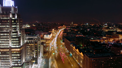 Naklejka premium Aerial shooting of Moscow Garden Ring in the late evening. City lights at night. Business center 