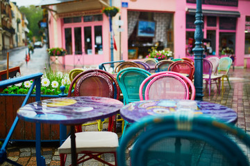 Colorful tables and chairs of a French cafe