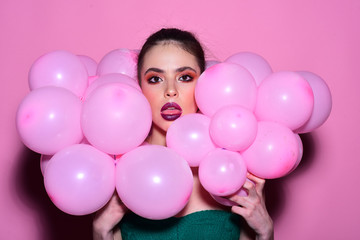 Fototapeta na wymiar girl dreaming in punchy pastels trend. girl with pink balloons at party.