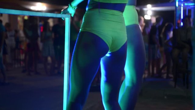 Girls ass naked go-go dancers PJ in a disco near the nightclub