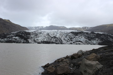 Fototapeta na wymiar Solheimajokull is a glacier in southern Iceland, between the volcanoes Katla and Eijafjallajokkull. Part of the larger Myrdalsjokull glacier, Solheimajokull is a prominent and popular tourist location