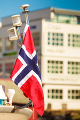Norwegian flag city street in the background