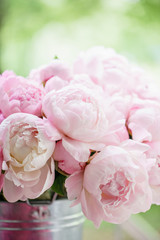 Lovely flowers in glass vase. Beautiful bouquet of pink peonies . Floral composition, scene, daylight. Wallpaper