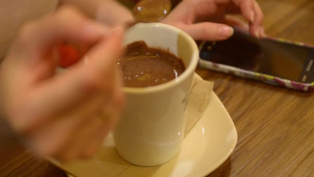 Cafe in Milan. Visitors drinking coffee eating hot chocolate